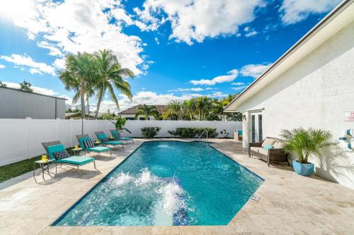 Singer Island House | Beach Lux - Heated Pool with Infinity Spa, Cabana, BBQ, Golden Tee - Walk to Beach - by Maven Vacation Rentals