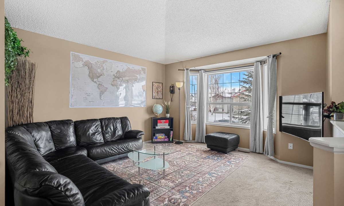 Southeast Edmonton House | Cozy travel-themed retreat near Tamarack shops, dining, games & coffee bar.