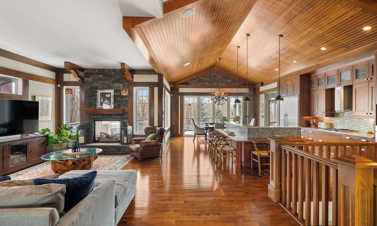 Southwest Edmonton House | Fortunato means "the fortunate one." This former Full House Lottery Dream Home has a private theatre, spa bathroom with soaker tub & heated towel drawer, a wine room, double sided fireplace & a full bar. Lodge luxury in Windermere.
