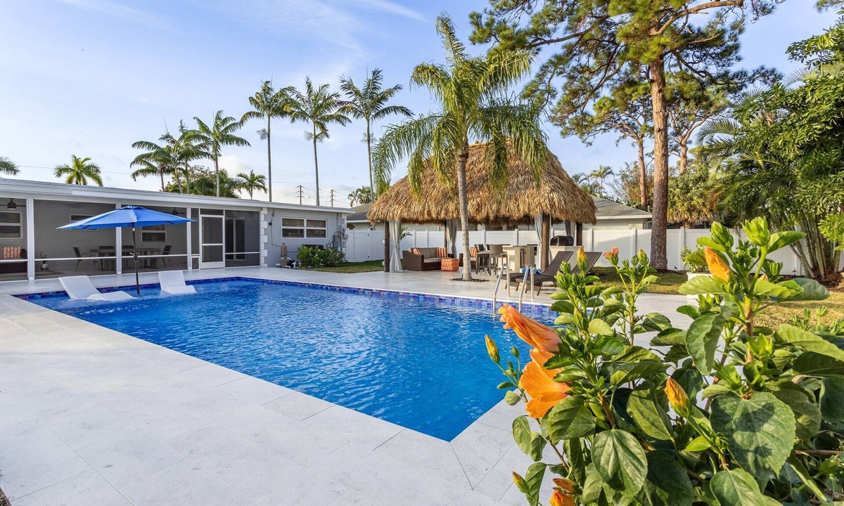 Boynton Beach House | Golfers Green Retreat with 35' Heated Saltwater Pool & Tiki. Pet Friendly!