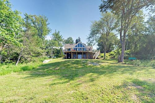 Lamoine Beach House | Renovated waterfront cottage with expansive deck, multiple fireplaces, & grill