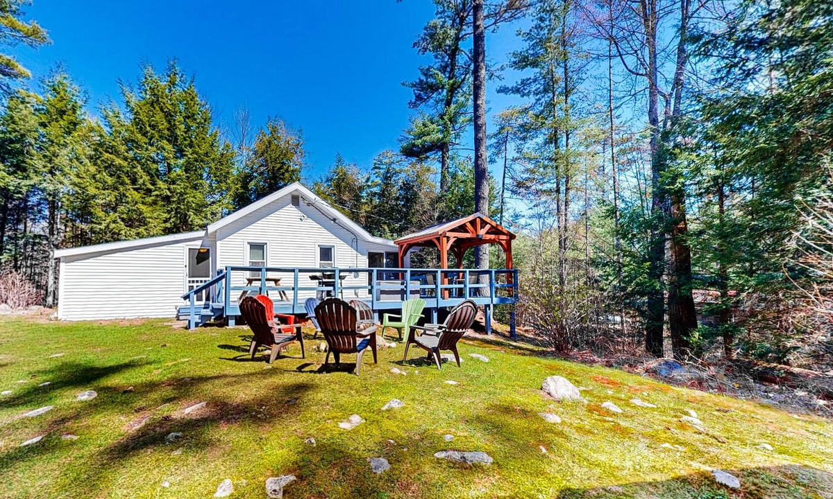 Warrensburg Cottage | Tree-lined dog-friendly cottage with wrap-around deck, grill, & gas fireplace