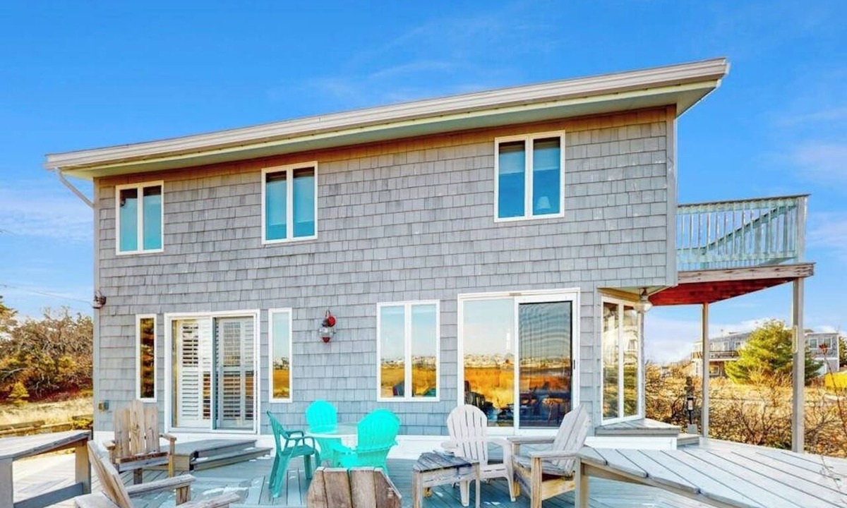 Newbury House | Two-story riverfront retreat with a furnished deck, views, & washer/dryer