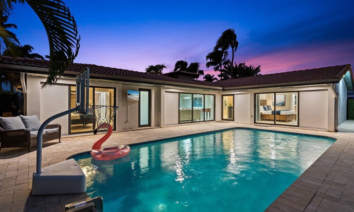 Lighthouse Point House | Waterfront~HUGE Heated Pool~Open Floor Plan~BIG Patio with Lots of Seating + Dock~Near Beaches