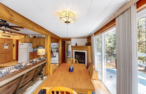 Warrensburg Cottage | Tree-lined dog-friendly cottage with wrap-around deck, grill, & gas fireplace