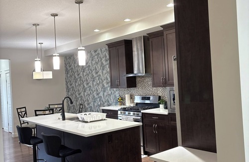 Calgary House | 3-bedroom house in pleasant Calgary with cool AC for relaxing stays