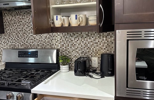 Calgary House | 3-bedroom house in pleasant Calgary with cool AC for relaxing stays