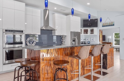 Fort Pierce House | 5BR/4.5B Beach House- heated pool, deep water dock, walk to beach!