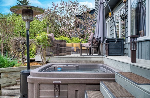 Northwest Calgary House | Almost 1/2 an acre on the Bow River, huge fenced yard, hot tub, firepit, games!