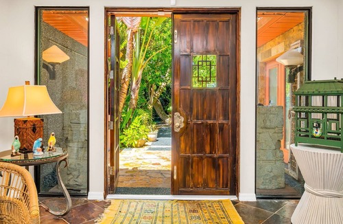 Parrot Cove House | Bali Inspired Home on Golf Course- 4 Bedroom + Heated Lagoon Pool!