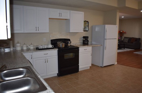 Aurora Apartment | Beautiful, new and spacious walk out basement