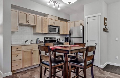 Canmore Condo | Best Relaxing King Bed Suite/Mtn. View, Heated Pool & Hot Tubs & Free Parking