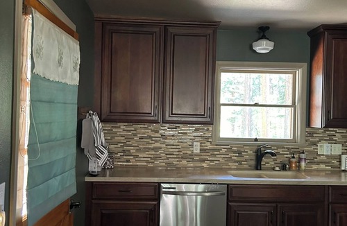 Rye Cabin | Cabin on the Creek, with fireplace, game room, fenced-in yard and firepit.