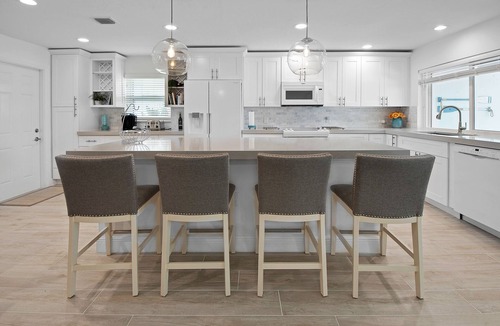 Isles of Capri House | CAPRI PARADISE! Beautiful waterfront home. Solar heated pool, 130ft dock.