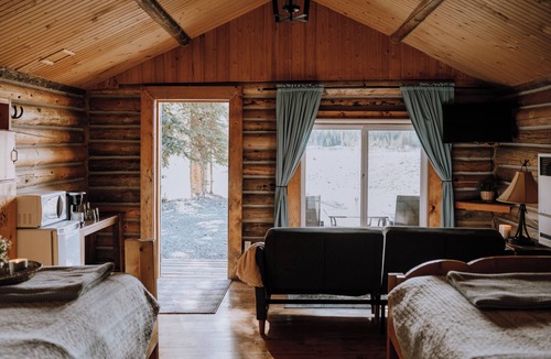 Red Deer River Crossing Cabin | Cedar Cabin: Sleeps 4 | Queen Bed | Mountain Views