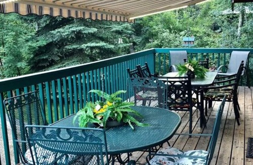 Sunbreaker Cove Cottage | Cedar Log Cottage , nestled in the trees with wrap around deck