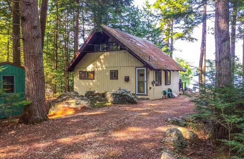 Meredith Cottage | Chalet-style lakefront home with private dock, beach, kayak, canoe & epic view