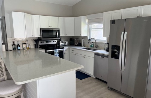 Jupiter Village House | Charming 3-bedroom pool home on the lake with spectacular sunsets & close to all