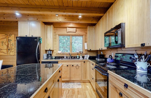 Boothbay Cabin | Charming, Lakefront Cabin with a Fireplace, Wood Stove, Kayaks, & Sandy Beach