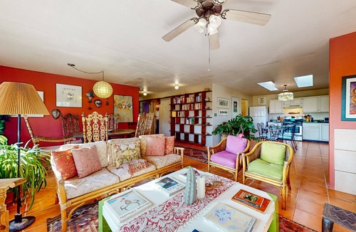 Taos House | Charming secluded home mountain views, covered front porch, & book collection
