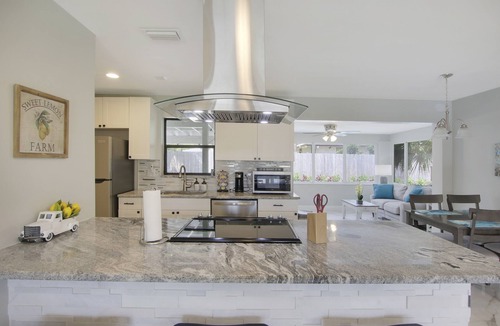 Juno Ridge House | Coastal house in Juno beach with heated saltwater pool. Walk to the local beach.