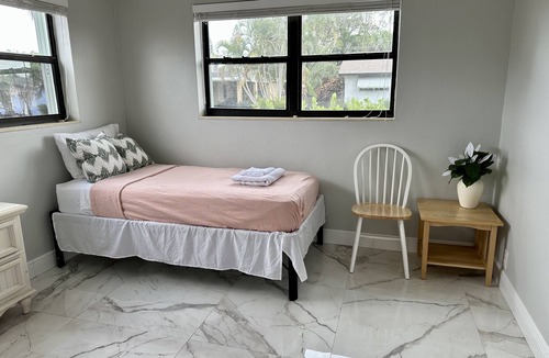 Juno Ridge House | Coastal house in Juno beach with heated saltwater pool. Walk to the local beach.