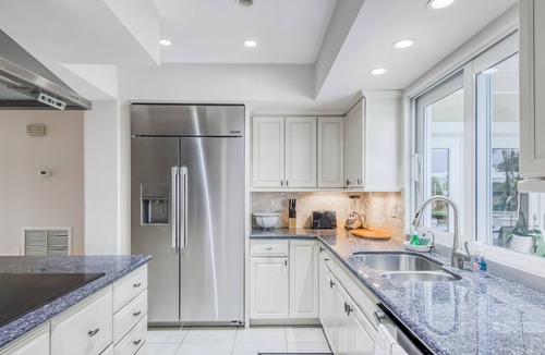 Singer Island House | Contemporary Canal-Front Home with Private Pool & Spa, Free WiFi & Private W/D