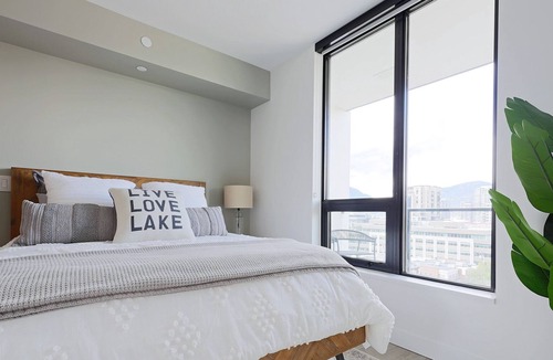 Kelowna Central Business District Condo | Cozy Downtown Suite w/ Stunning Design & Lake View