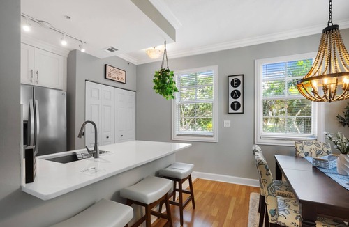 East Ocean Ave House | Cozy orange beachside townhouse with yard, Wi-Fi, & full kitchen in Lantana!