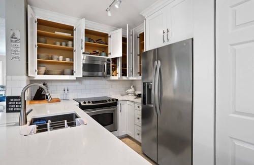 East Ocean Ave House | Cozy orange beachside townhouse with yard, Wi-Fi, & full kitchen in Lantana!