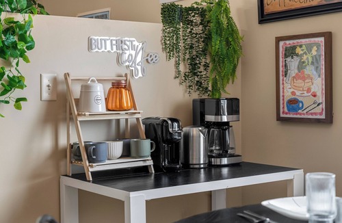 Southeast Edmonton House | Cozy travel-themed retreat near Tamarack shops, dining, games & coffee bar.