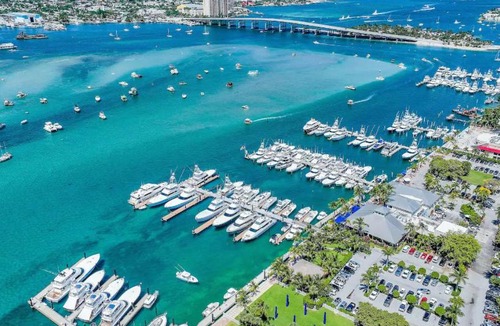 Palm Beach Shores Apartment | Dog friendly condo with beach access, hot tub & firepit
