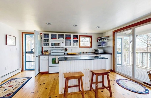 East Boothbay House | Dog-friendly river-view home with wood stove, deck, patio, dock, beach, grill