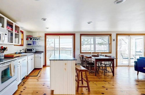 East Boothbay House | Dog-friendly river-view home with wood stove, deck, patio, dock, beach, grill