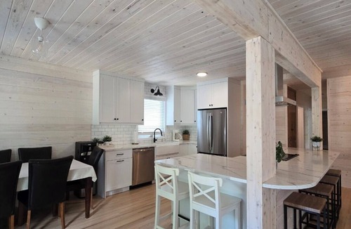 Christopher Lake Cabin | Emma Lake Sunset Bay retreat! One minute walk to the beach with large deck/yard!