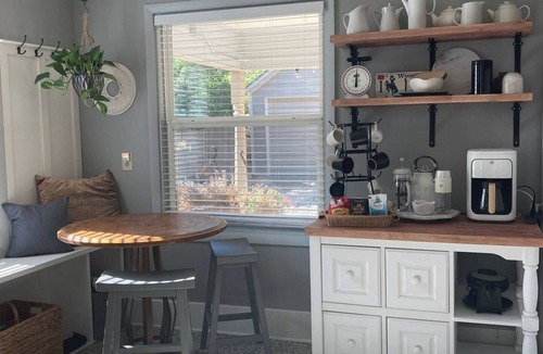 Sheridan Cottage | Escape to this stylish, centrally-located, updated home, perfect for families or groups. Featuring a modern kitchen, private fenced backyard with a gas fire column, and flexible sleeping arrangements for up to 6 guests.
