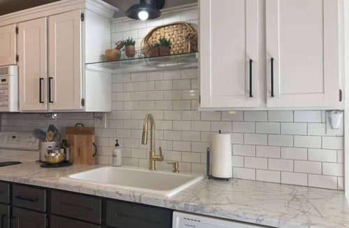 Sheridan Cottage | Escape to this stylish, centrally-located, updated home, perfect for families or groups. Featuring a modern kitchen, private fenced backyard with a gas fire column, and flexible sleeping arrangements for up to 6 guests.