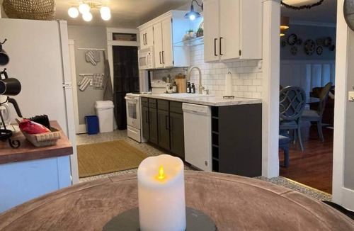 Sheridan Cottage | Escape to this stylish, centrally-located, updated home, perfect for families or groups. Featuring a modern kitchen, private fenced backyard with a gas fire column, and flexible sleeping arrangements for up to 6 guests.