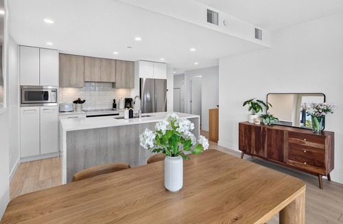 South Pandosy Apartment | Experience luxury waterfront living at Aqua Waterfront Village. This stylish 2BR, 2BA condo features designer interiors, two queen bedrooms, a spacious covered patio, chef's kitchen, and resort-style amenities just steps from Okanagan Lake.