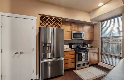 Old Town North Apartment | FoCo Patio Oasis – King Beds & Walkable Location