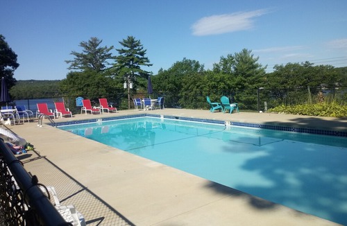 Laconia Resort | Great location with lake views ,pool and private beach.