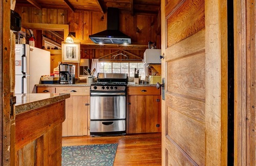 Estes Park House | Historic Cabin with a Mix of Antique and Modern; Croquet Court to Try Your Skill
