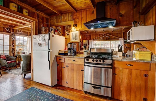 Estes Park House | Historic Cabin with a Mix of Antique and Modern; Croquet Court to Try Your Skill