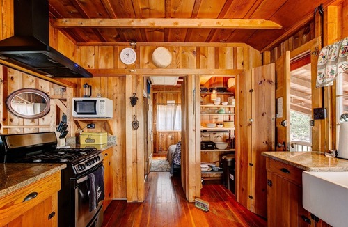 Estes Park House | Historic Cabin with a Mix of Antique and Modern; Croquet Court to Try Your Skill
