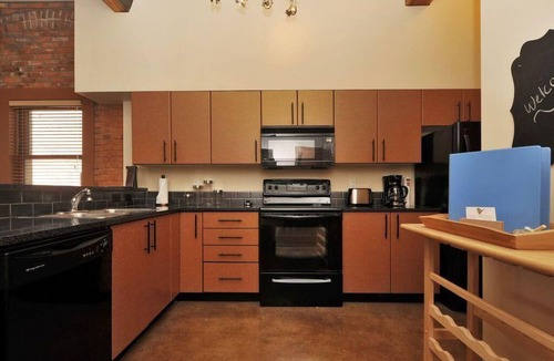 Downtown Victoria Condo | Historic Loft w/Exposed Brick & Timber Beams