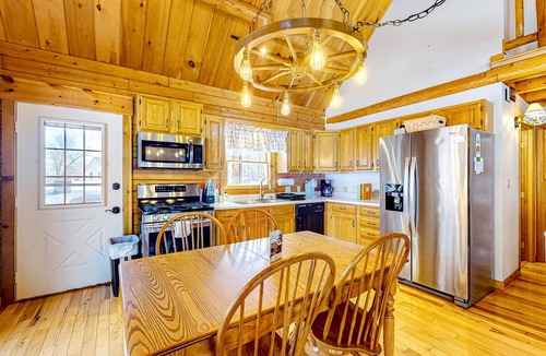 Meredith House | Idyllic lake retreat with beach access, firepit, wraparound porch, & great views
