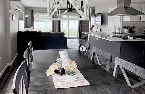 Lochmere House | Lakefront 3-bedroom Duplex on Lake Winnisquam, docks, Beach, WiFi, AC. B2A