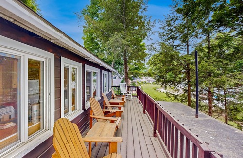 Laconia House | Lakefront cabin with deck, gas grill, kayaks, fireplace, & quick beach access