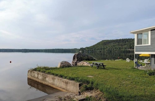 Dedham House | Light-filled lakefront home for up to 15 with private beach and dock near Acadia