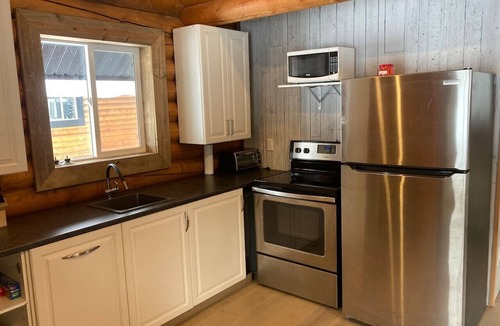 Central Okanagan Apartment | Lofted log cabin with fire table